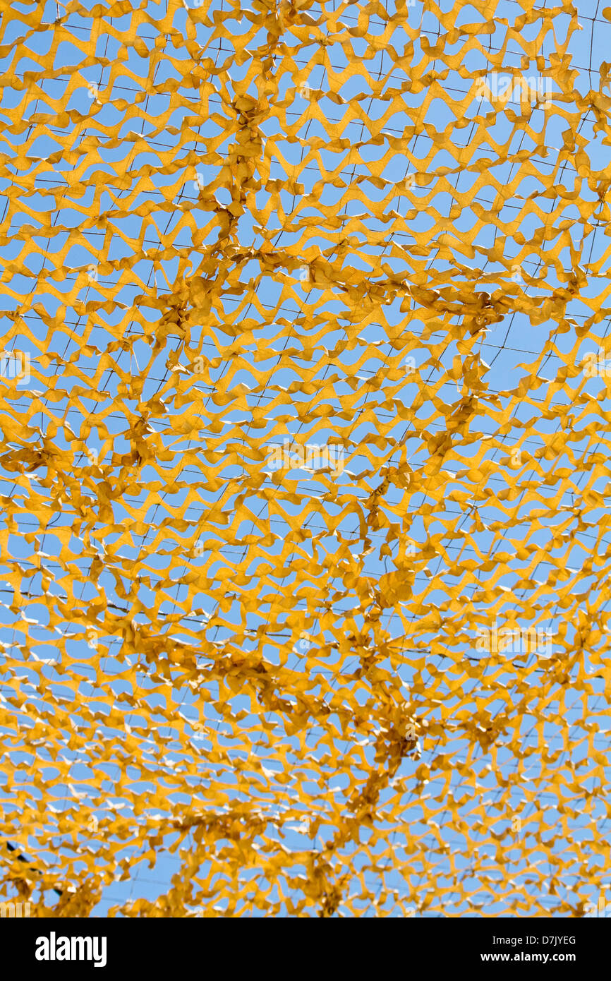 Close view of a military cover net over a blue sky Stock Photo - Alamy