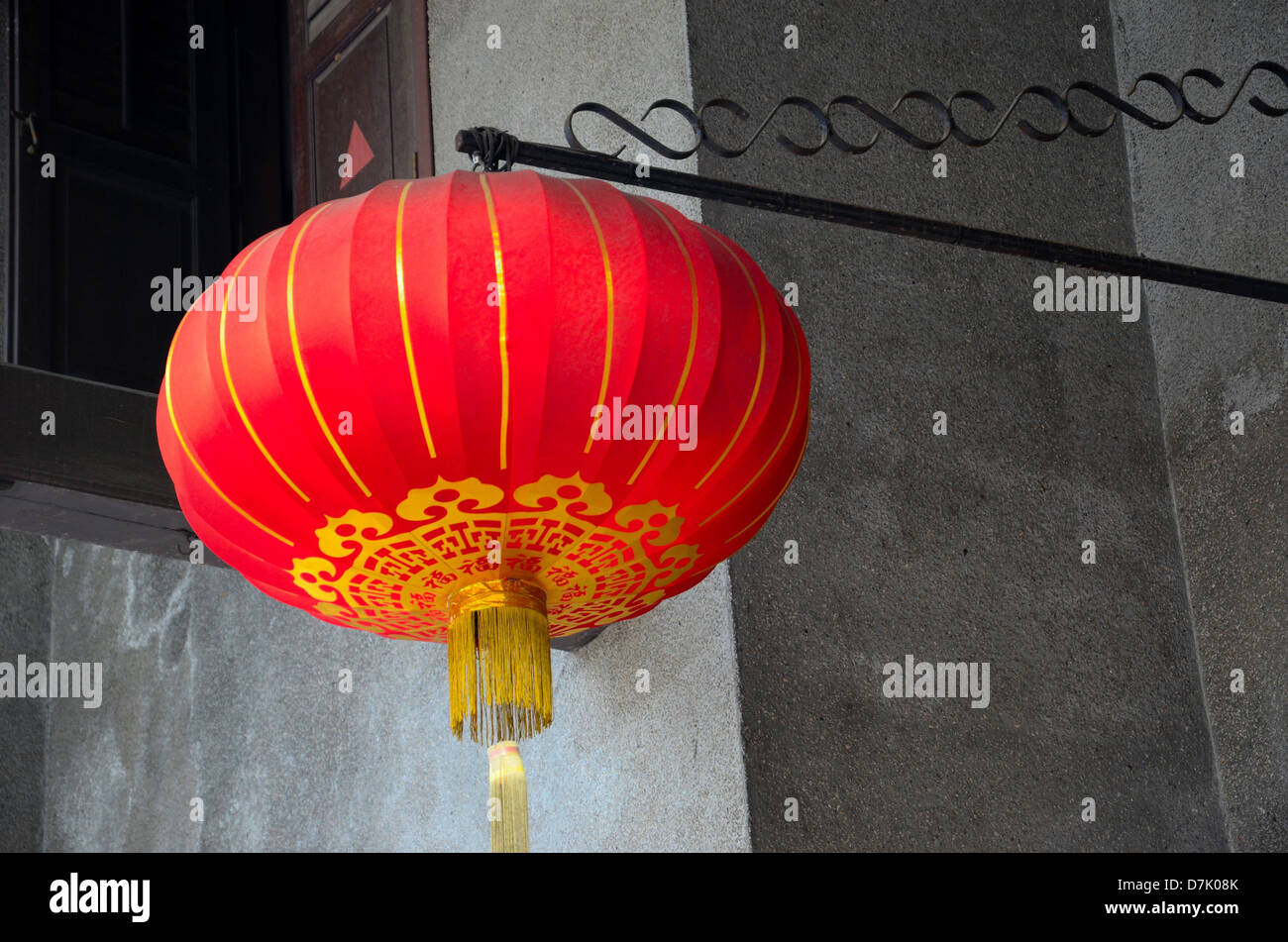 Hanging red Chinese lantern with golden tassels Stock Photo - Alamy