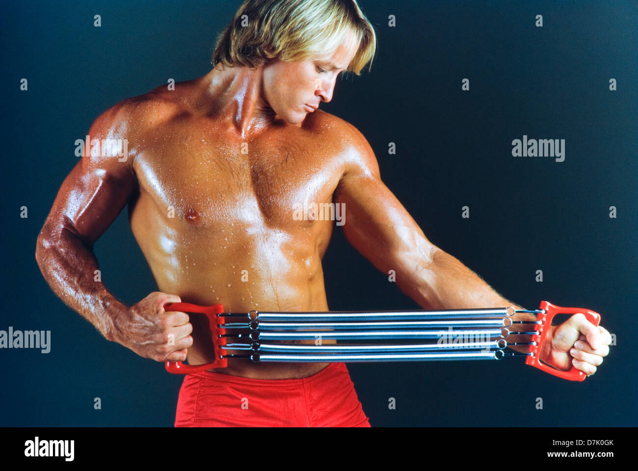 Male athlete in gym with exercise apparatus, concept, strength Stock Photo