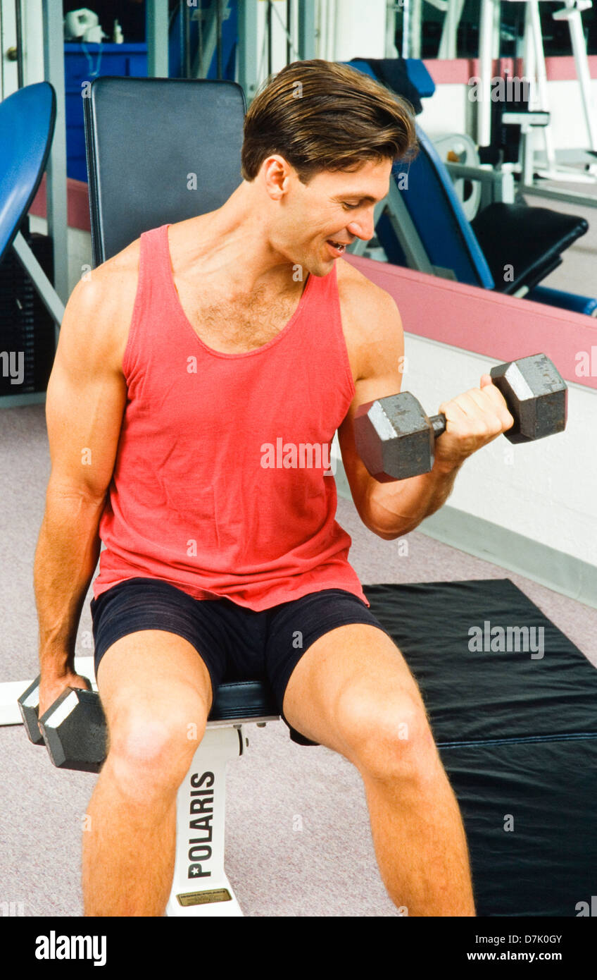 Man working out in Gym with weights, Miami Stock Photo