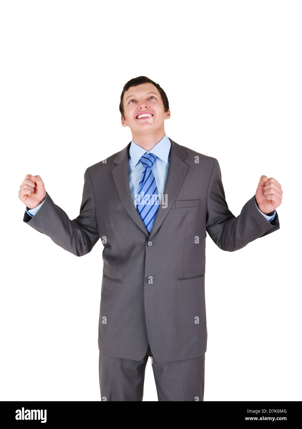 Happy young businessman with his hands up on white background Stock ...