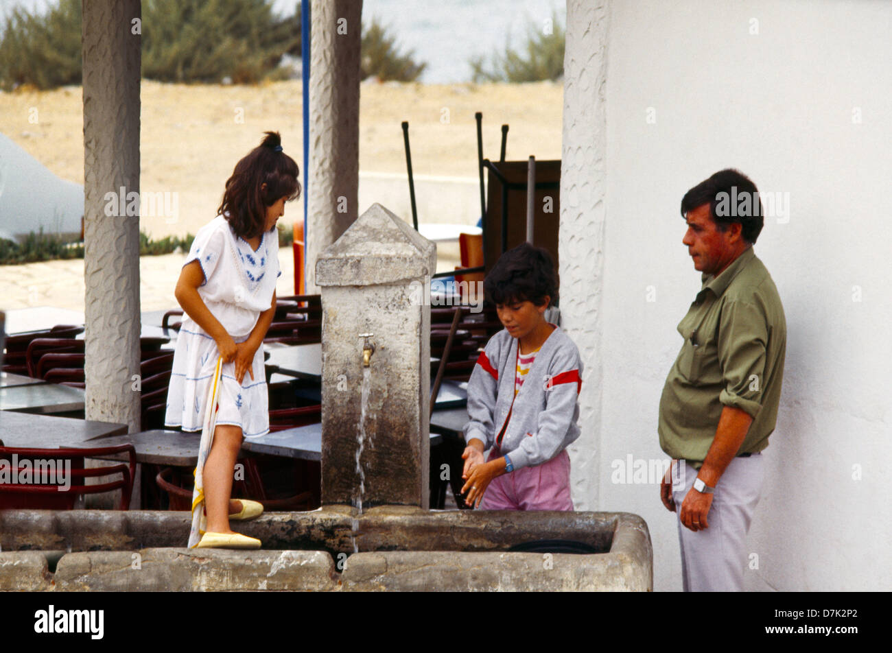 Near Caiscais Portugal Family Washing Hands Under Tap Outside Restaurant Stock Photo