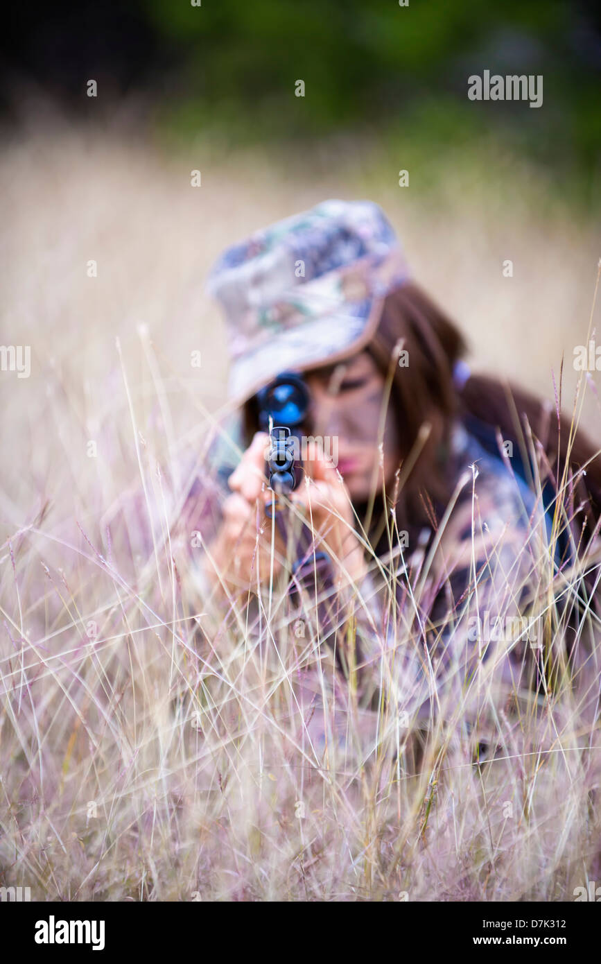 USA, Texas, Young woman with hunting rifle Stock Photo - Alamy