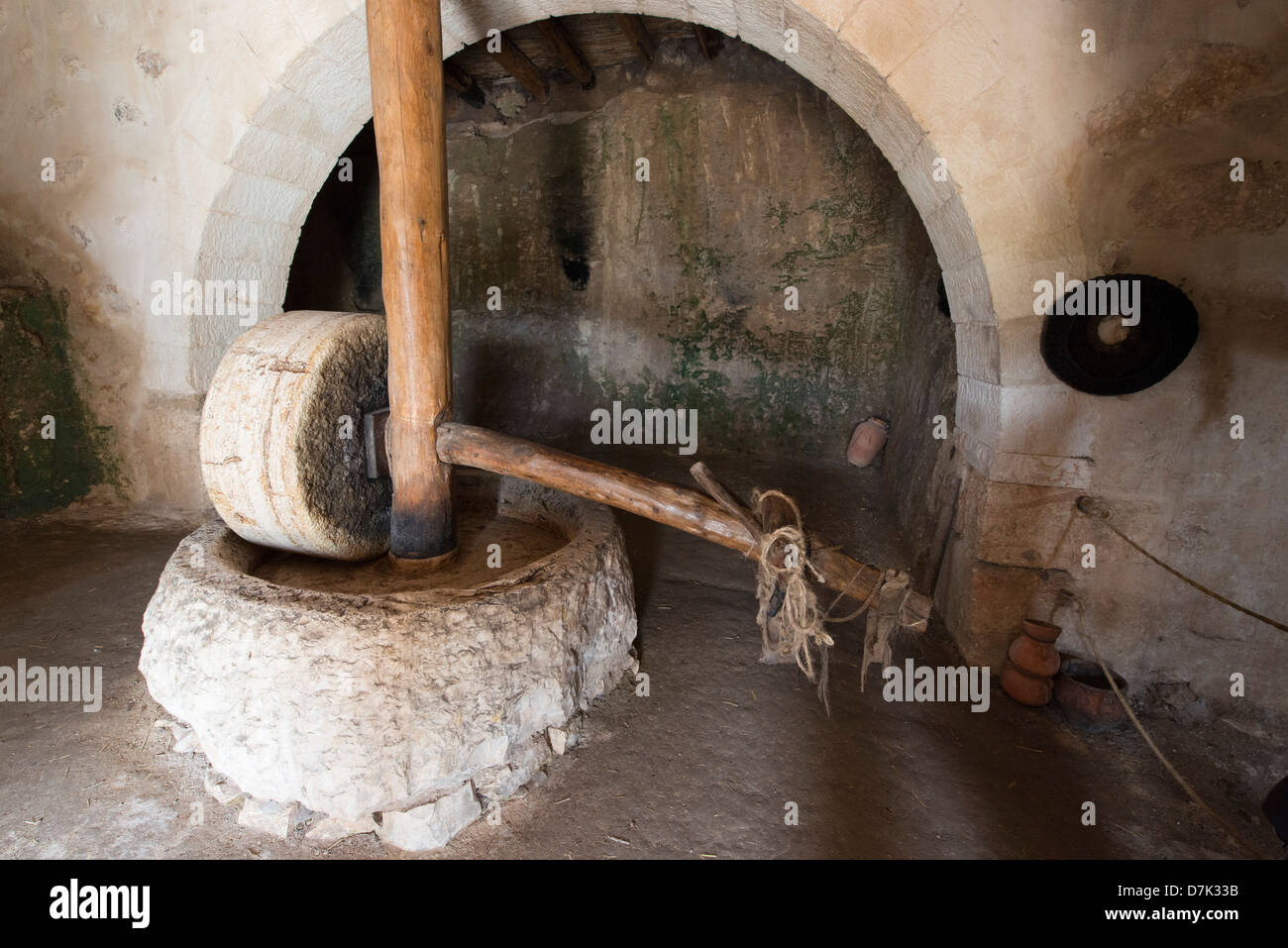 Olive press for crushing olives in oil production at a reconstruction