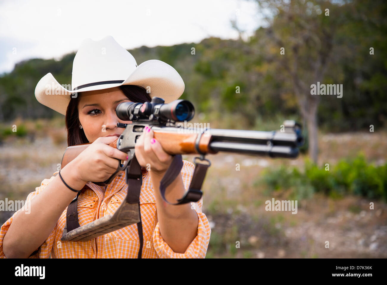USA, Texas, Young woman with hunting rifle Stock Photo Alamy
