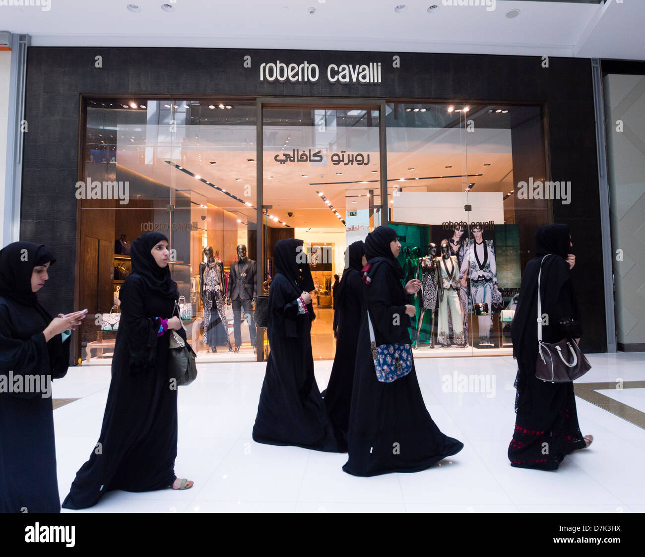 Roberto Cavalli boutique and shoppers at The Dubai Mall in Dubai United Arab Emirates Stock Photo