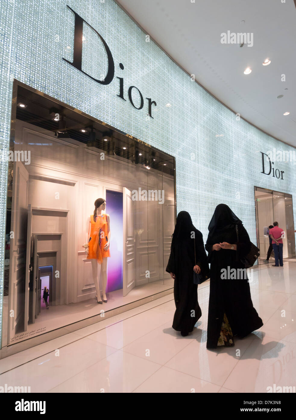 Dior boutique and shoppers at The Dubai Mall in Dubai United Arab Emirates Stock Photo