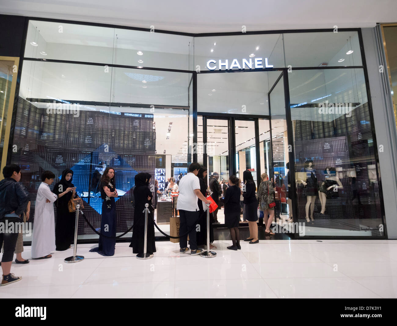 Queue of shoppers outside Chanel boutique at The Dubai Mall in Dubai United Arab Emirates Stock Photo