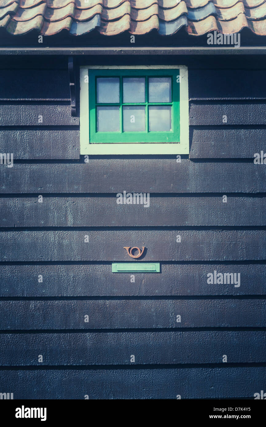 a wooden house with a letter box Stock Photo