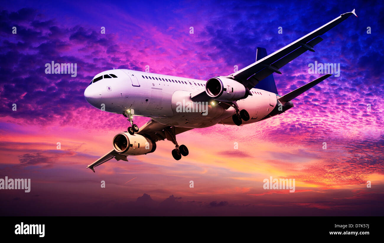 Jet is maneuvering in spectacular sunset sky Stock Photo
