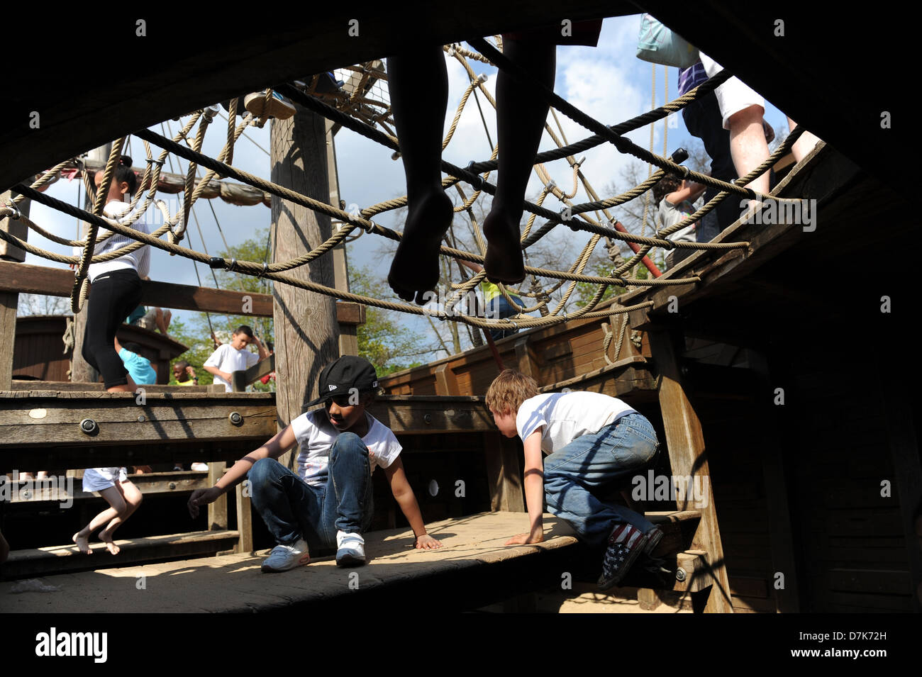 Children playing on the pirate ship in the Princess Diana memorial garden, kensington gardens,london Stock Photo