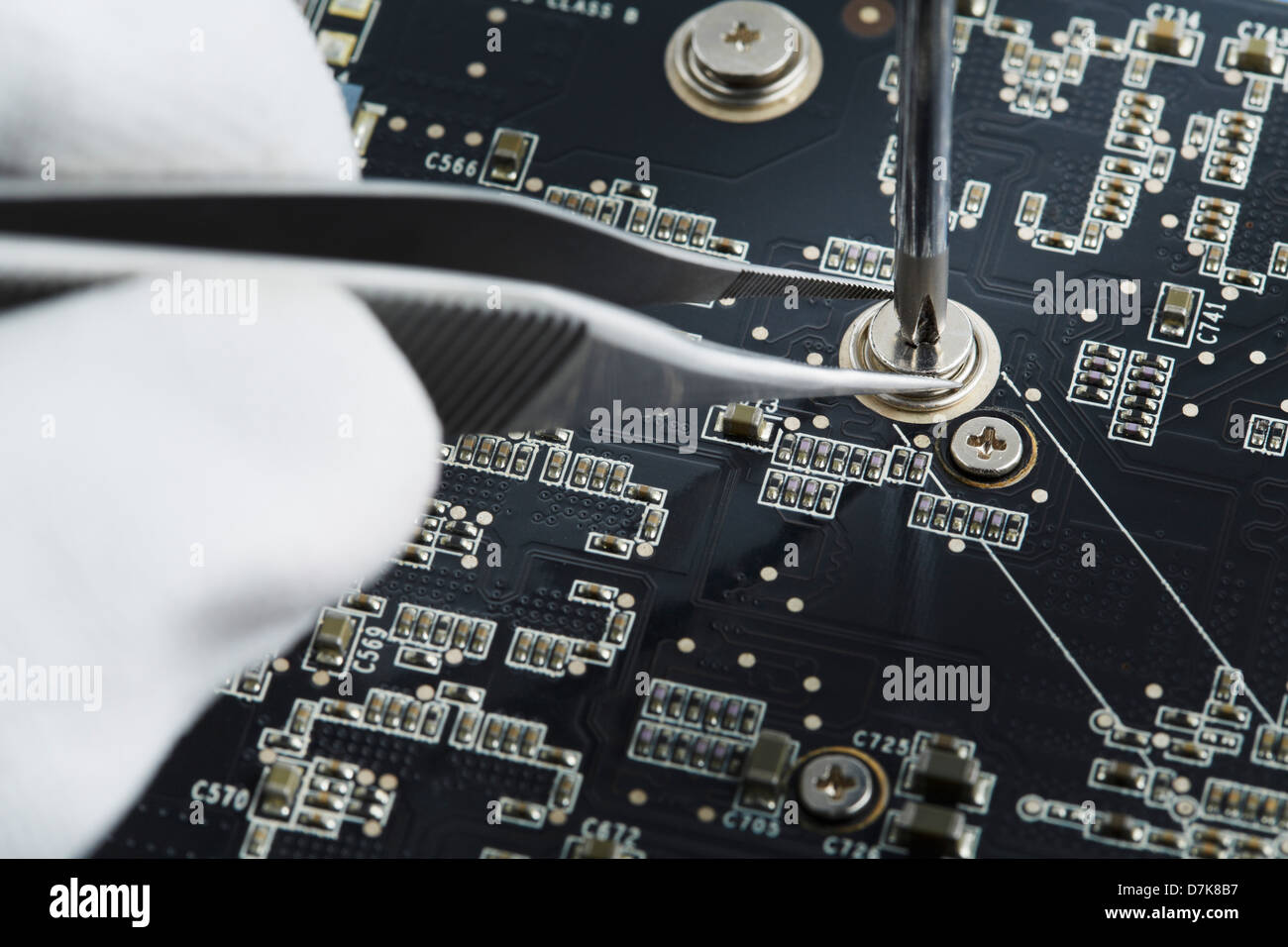 Human hand repairing printed circuit board, close up Stock Photo Alamy