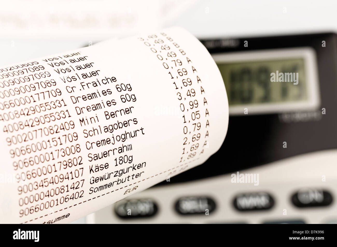 Shopping receipt for groceries with calculator, close up Stock Photo