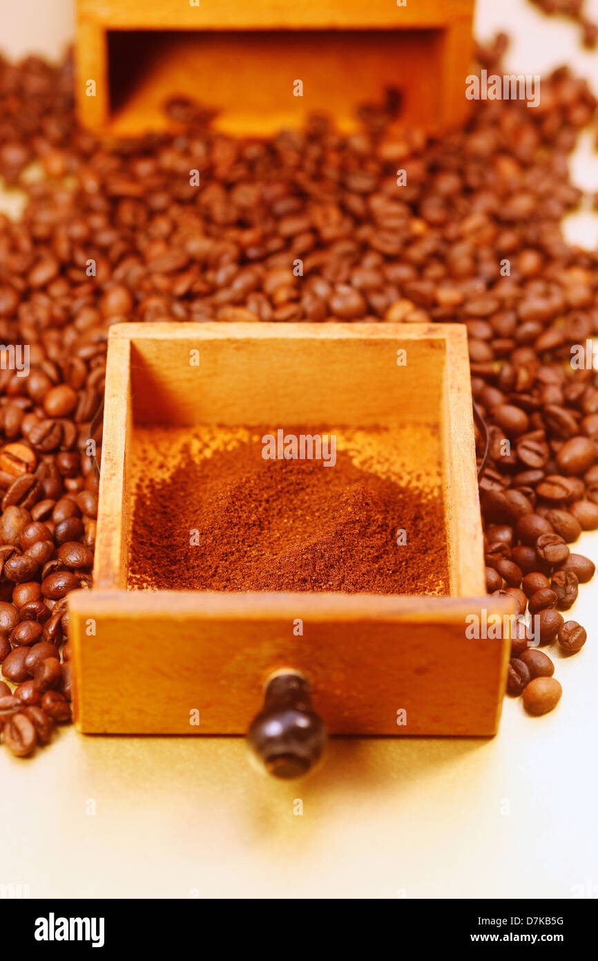 Germany, Wood drawer with ground and whole coffeebeans, close up Stock Photo