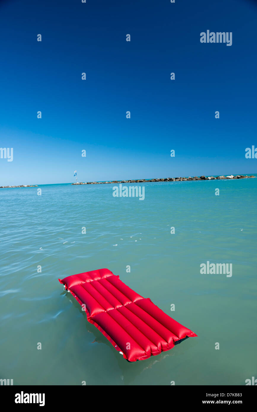 Italy, Air mattress floating on water Stock Photo Alamy