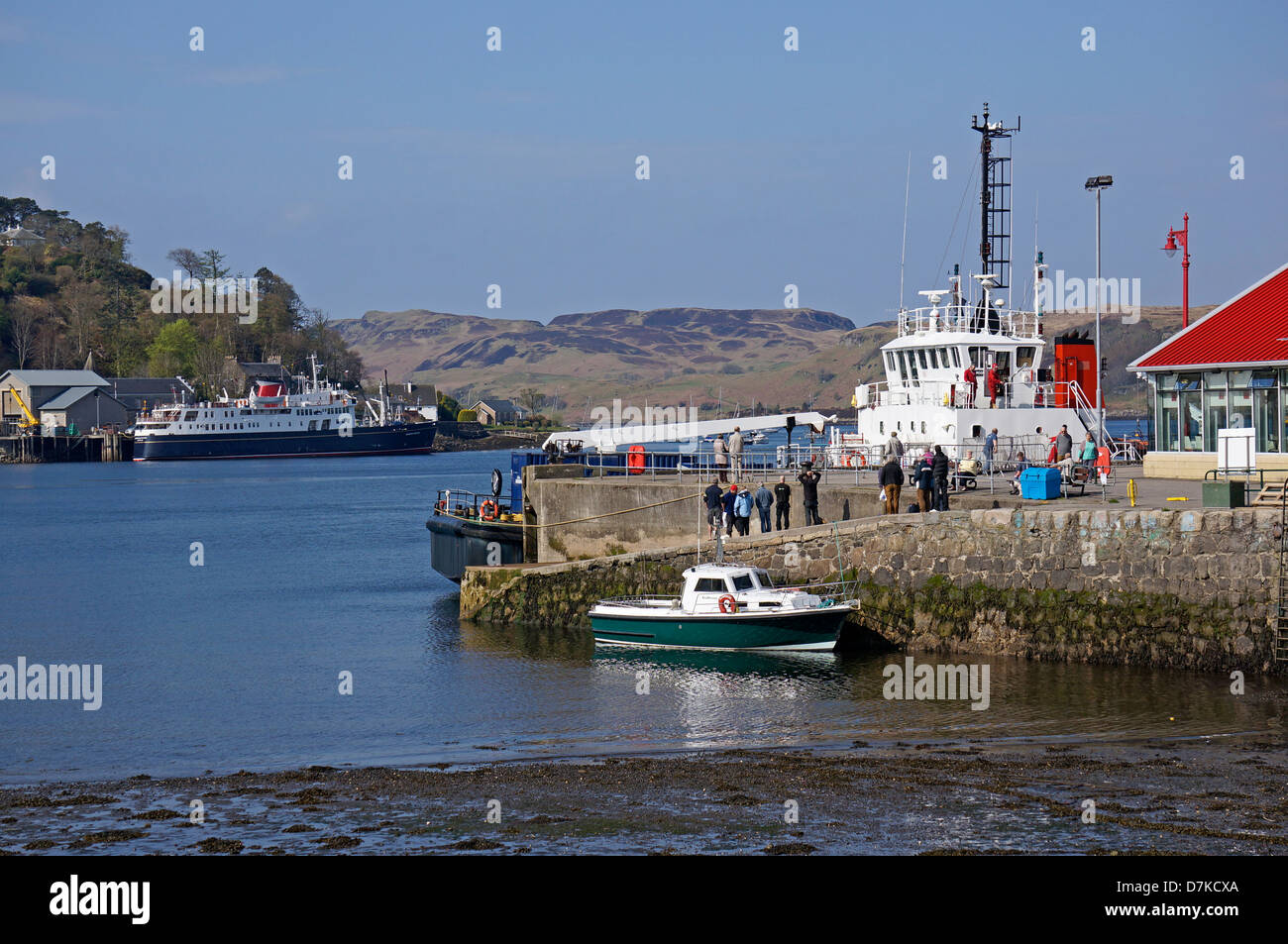 View across Oban Bay to Hebridean Princess with diving platform SD Moorhen moored at the North Pier in Oban Harbour Scotland Stock Photo