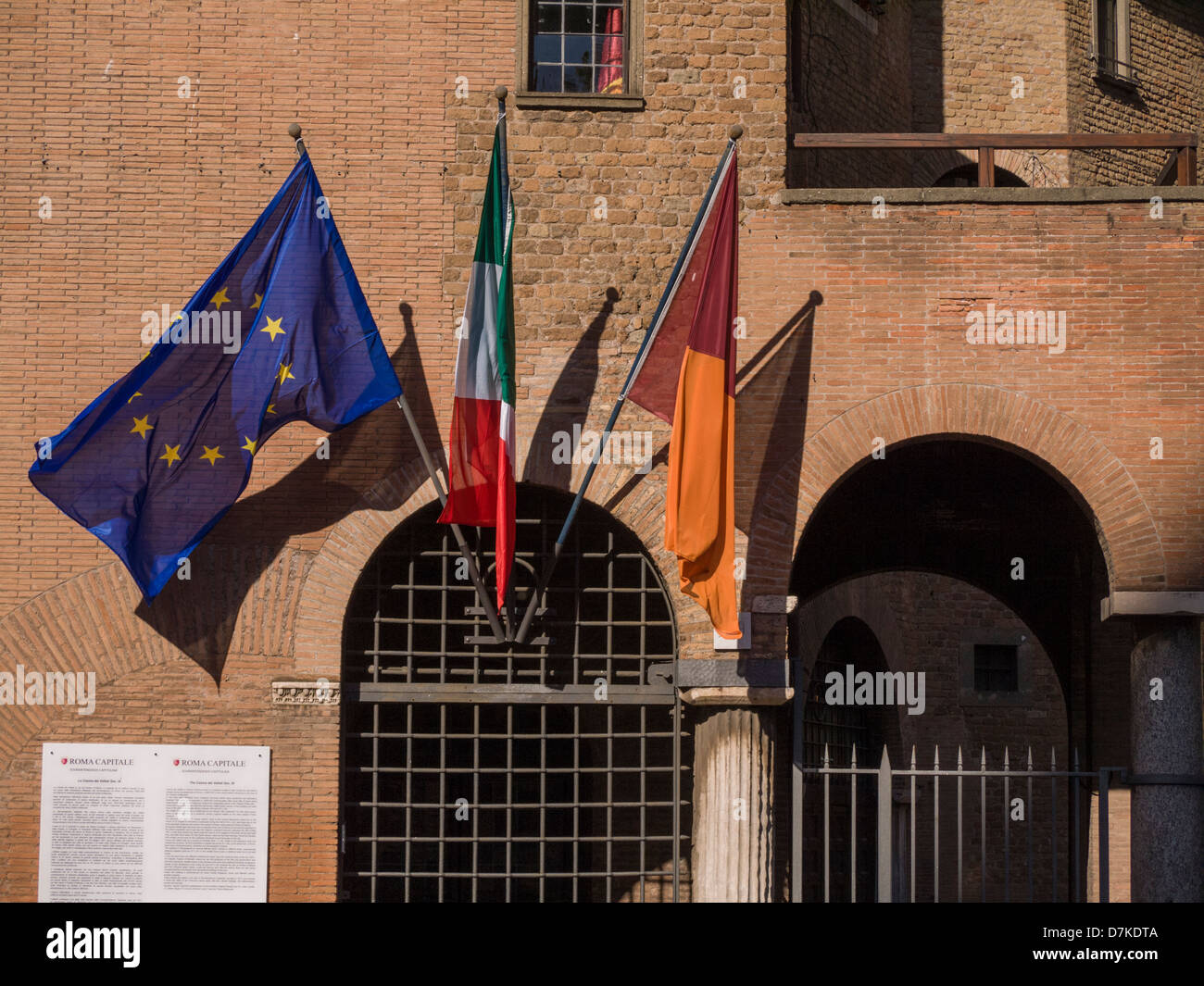 flags are flying on an old building, Europe, Italy Stock Photo