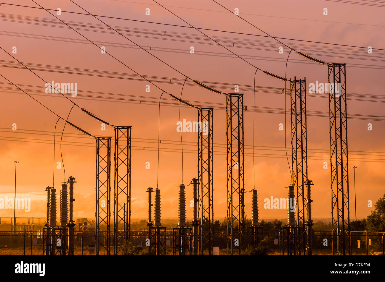 Power Transmission towers with orange sunset sky Stock Photo Alamy