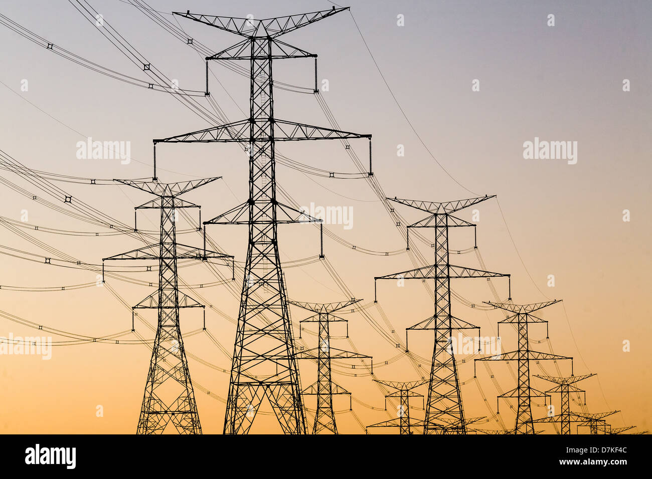 Power Transmission towers and lines against a sunset sky Stock Photo ...