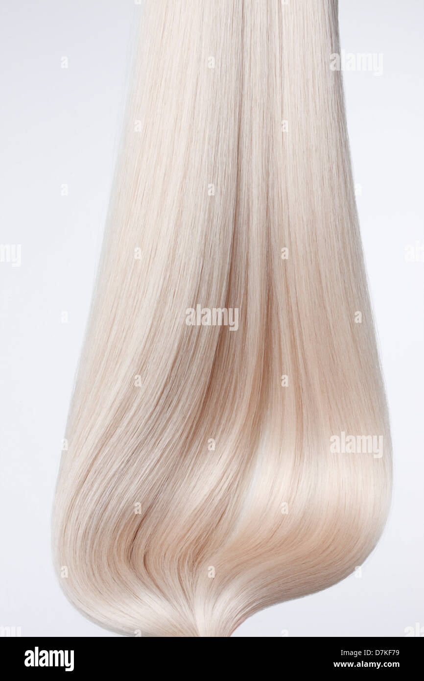 Close up of blond hair against white background Stock Photo