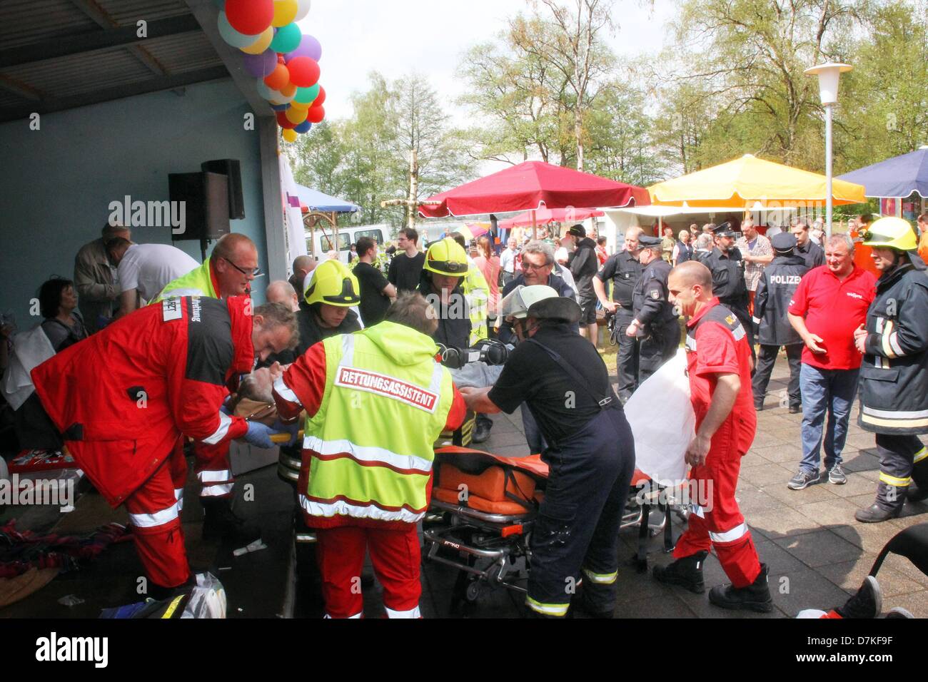 Rescue workers care for injured people after a lightning strike at a