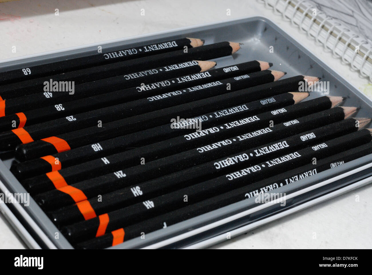 A tray of artist pencils Stock Photo