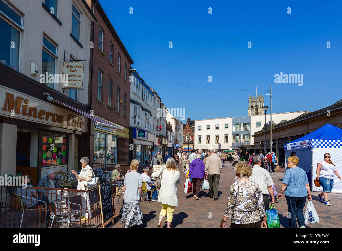 Cafe and shops on the Market Place with spire of St George's Minster in the distance, Doncaster, South Yorkshire, England, UK Stock Photo