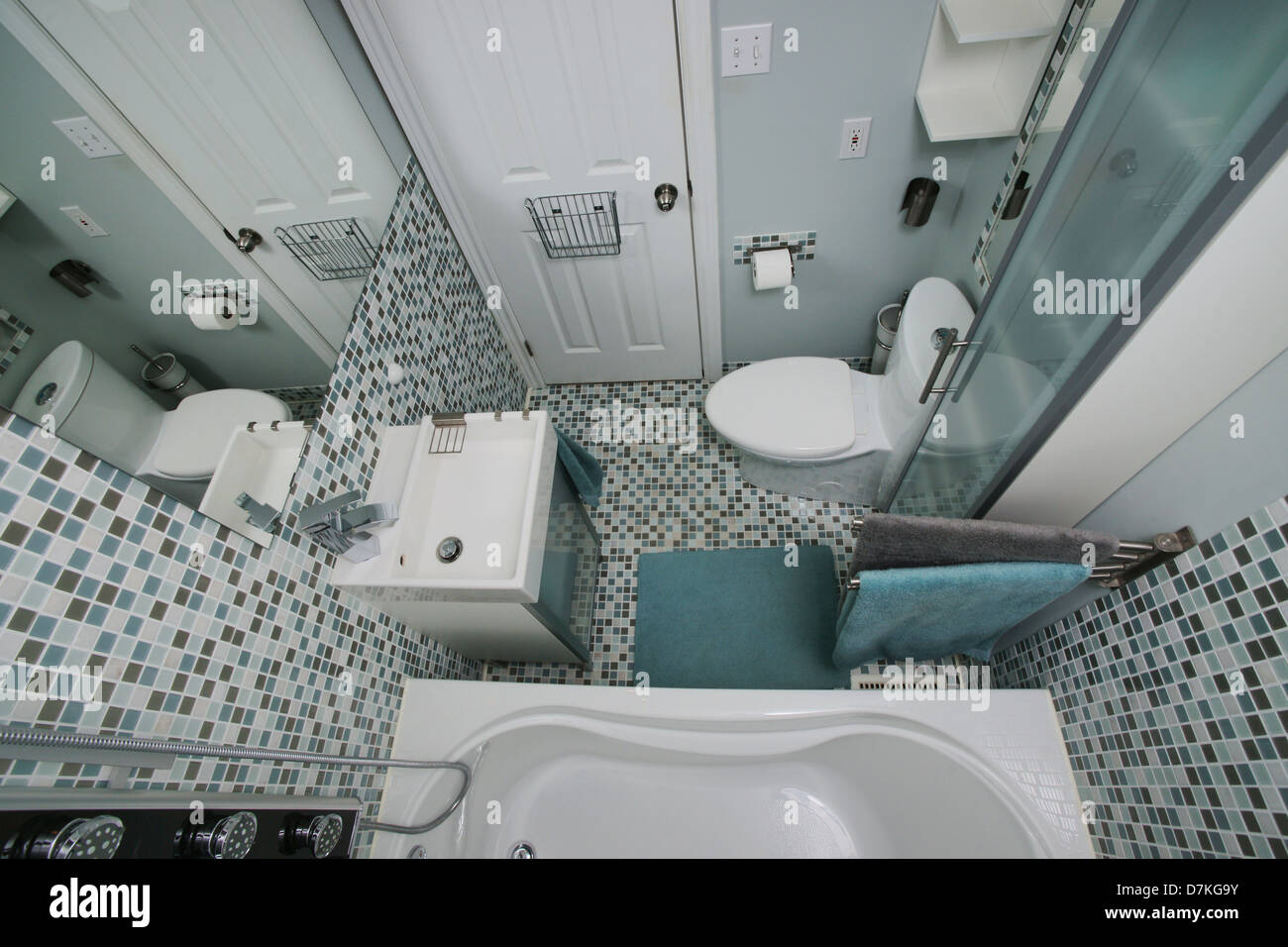 Small, modern bathroom interior. Mosaic tiles. White. Blue. Gray. Stock Photo