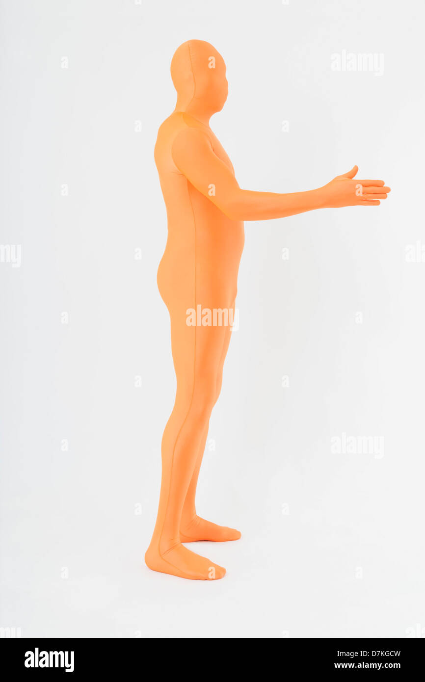 A Person in Black Zentai Suit Lying on a White Surface · Free Stock Photo