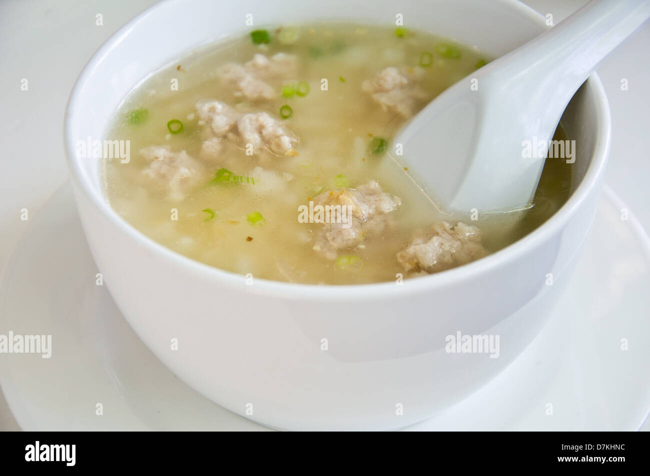 boil rice with pork for meal Stock Photo