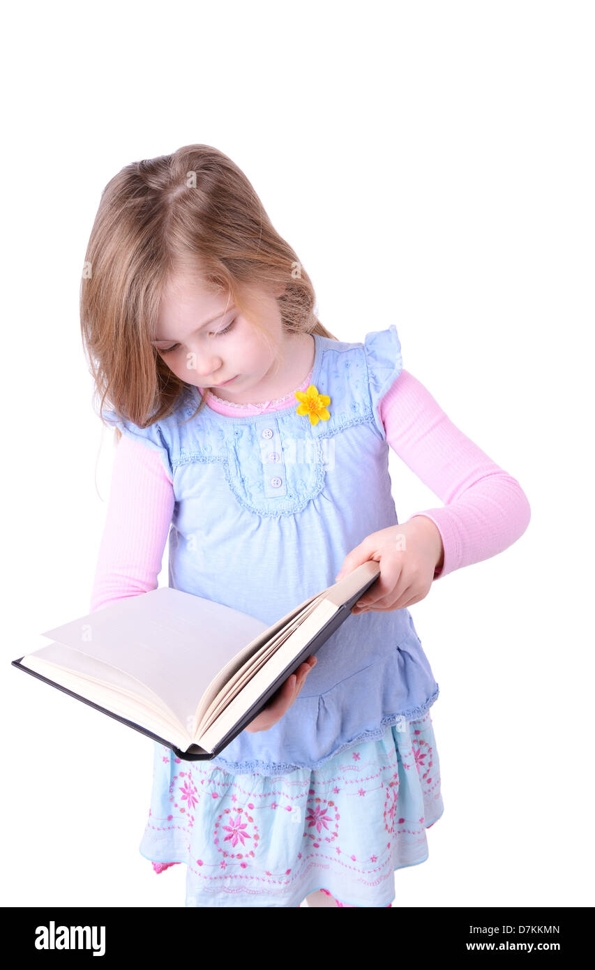 little girl reading a big book isolated on white background Stock Photo