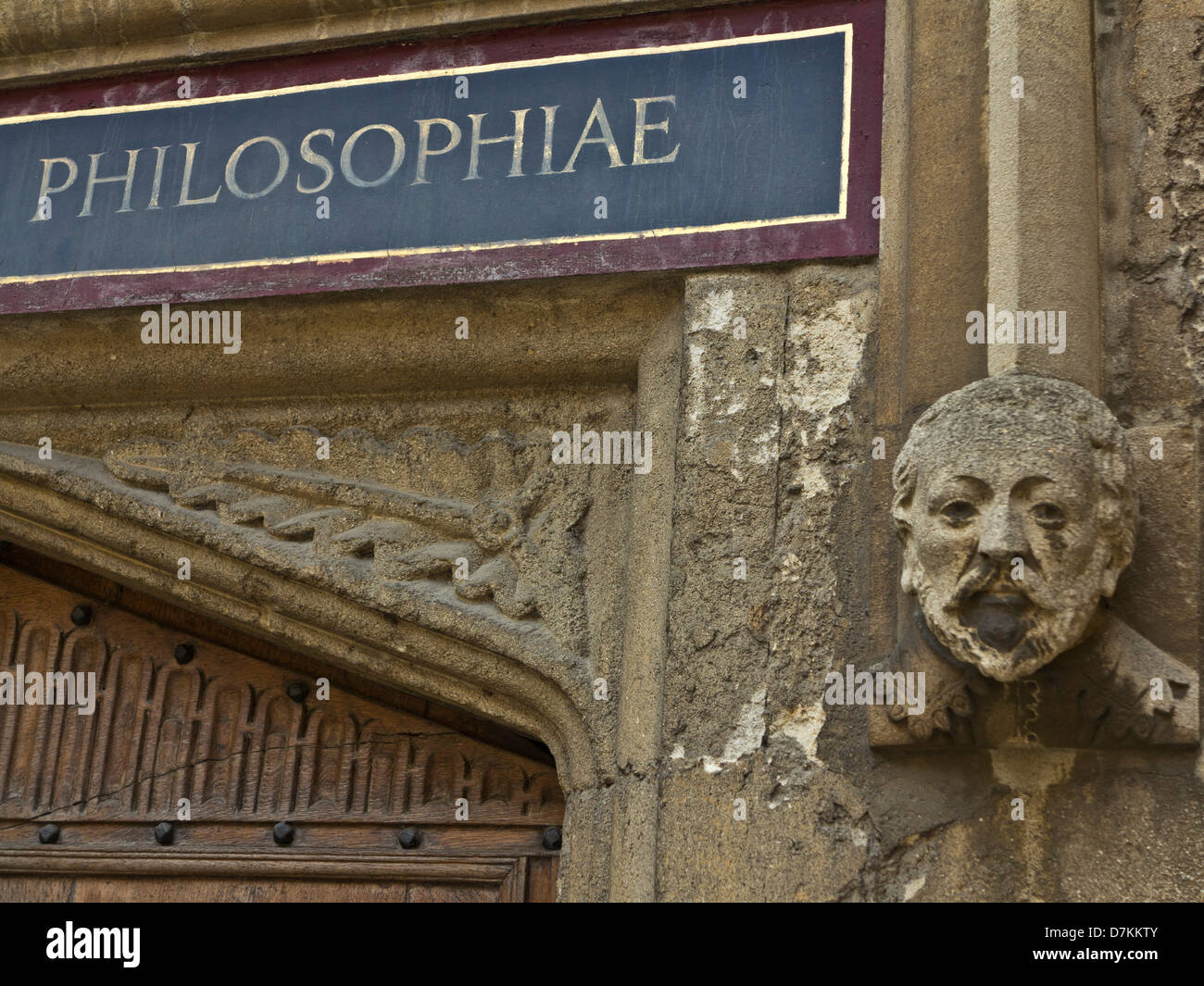 Gargoyle and sign in latin at the Bodleian library in Oxford, England