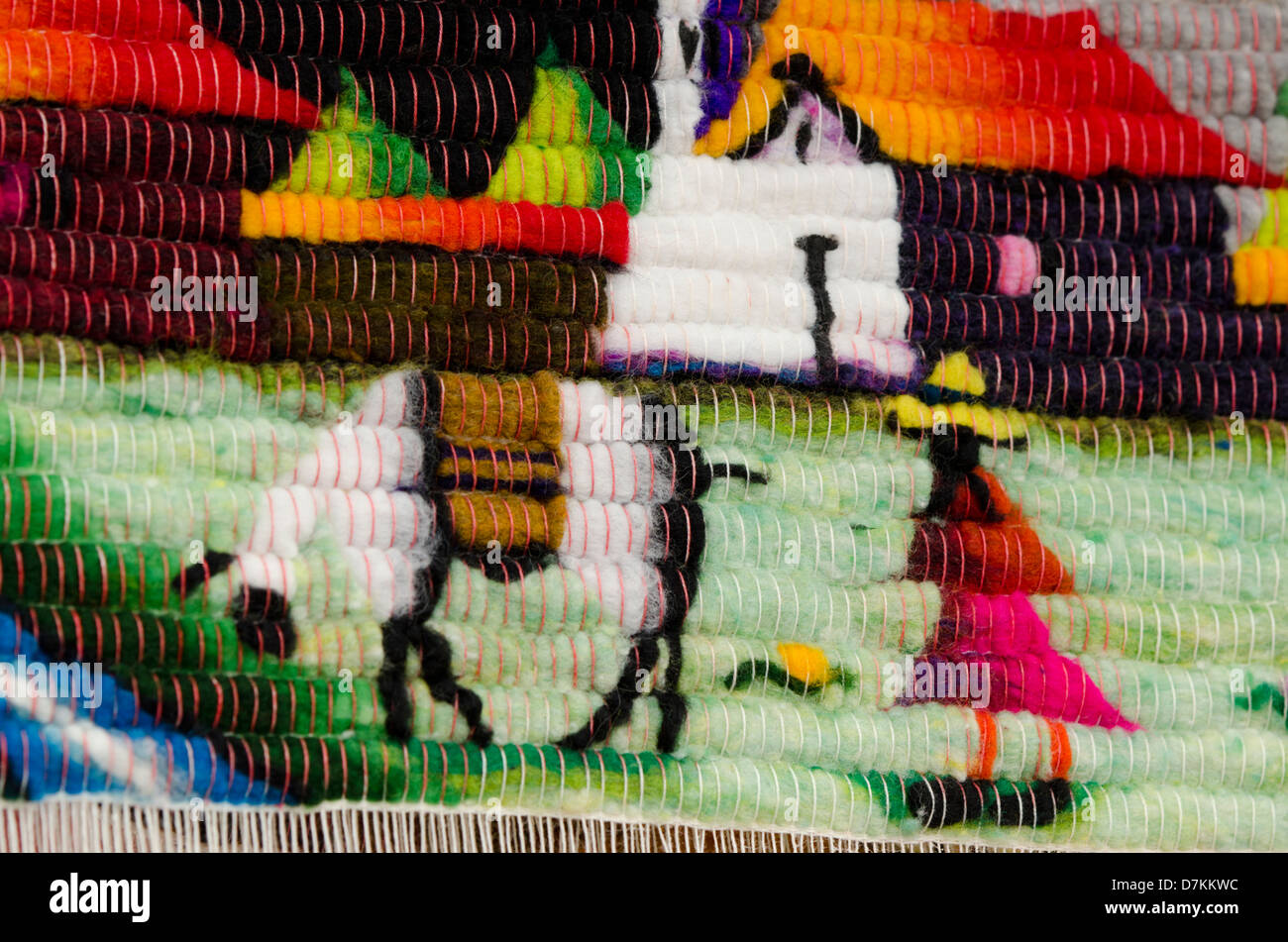 Ecuador, Quito area, Otavalo Handicraft Market. Detail of traditional wool souvenir rug. Stock Photo
