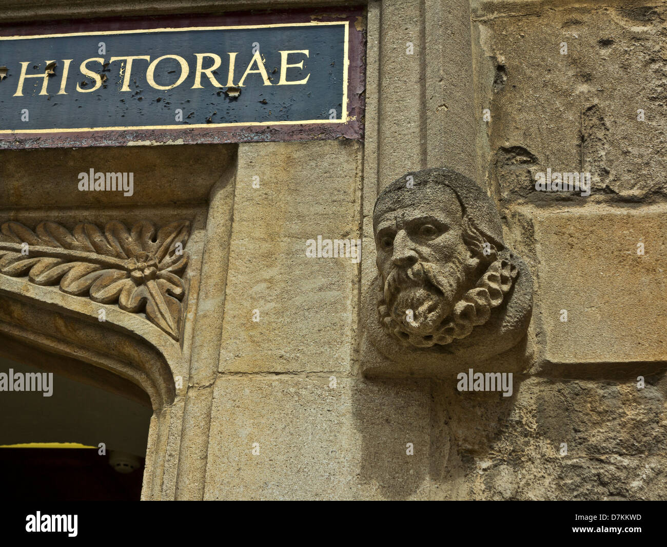 Gargoyle and sign in latin at the Bodleian library in Oxford, England