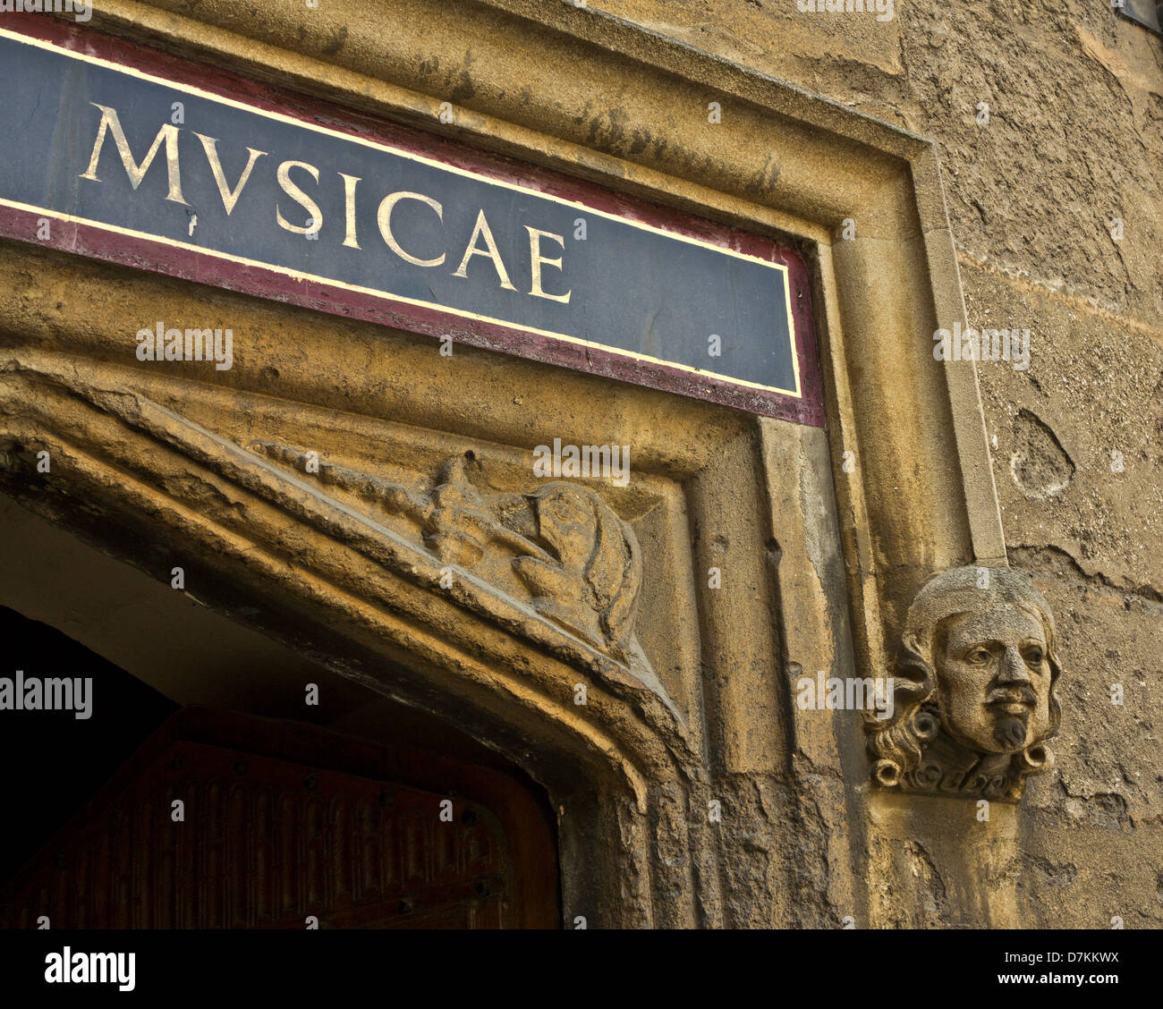 Gargoyle and sign in latin at the Bodleian library in Oxford, England