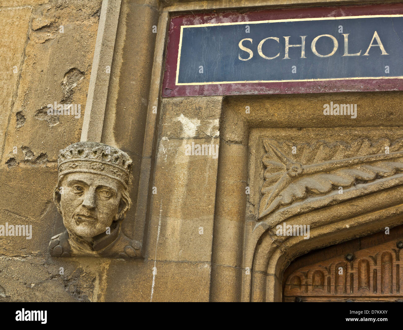 Gargoyle and sign in latin at the Bodleian library in Oxford, England