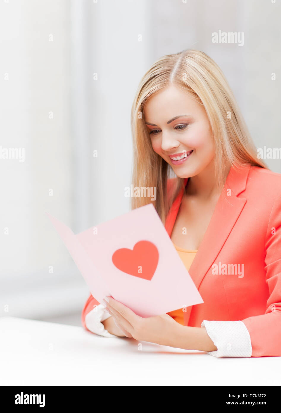 woman holding postcard with heart shape Stock Photo Alamy