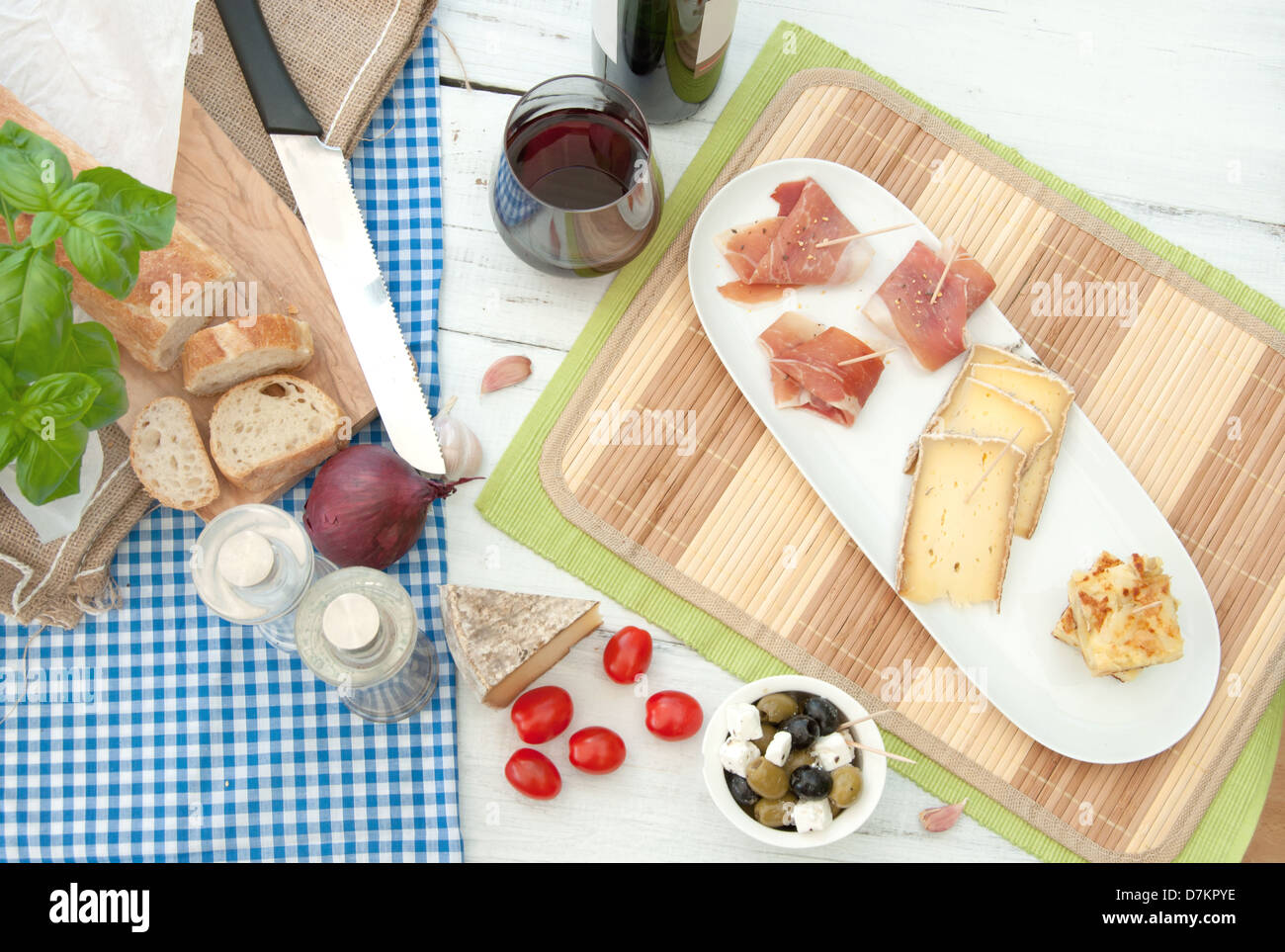 Spanish food snacks consisting of potato omelette, cheese and serrano ham Stock Photo