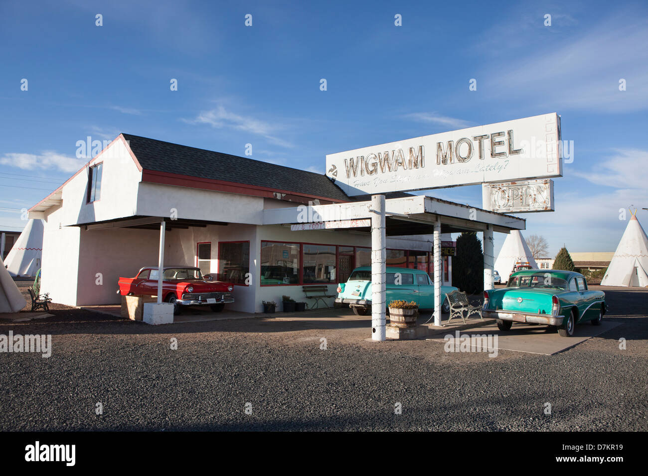 Some old cars parked outside the reception at Wig Wam Motel in Holbrook