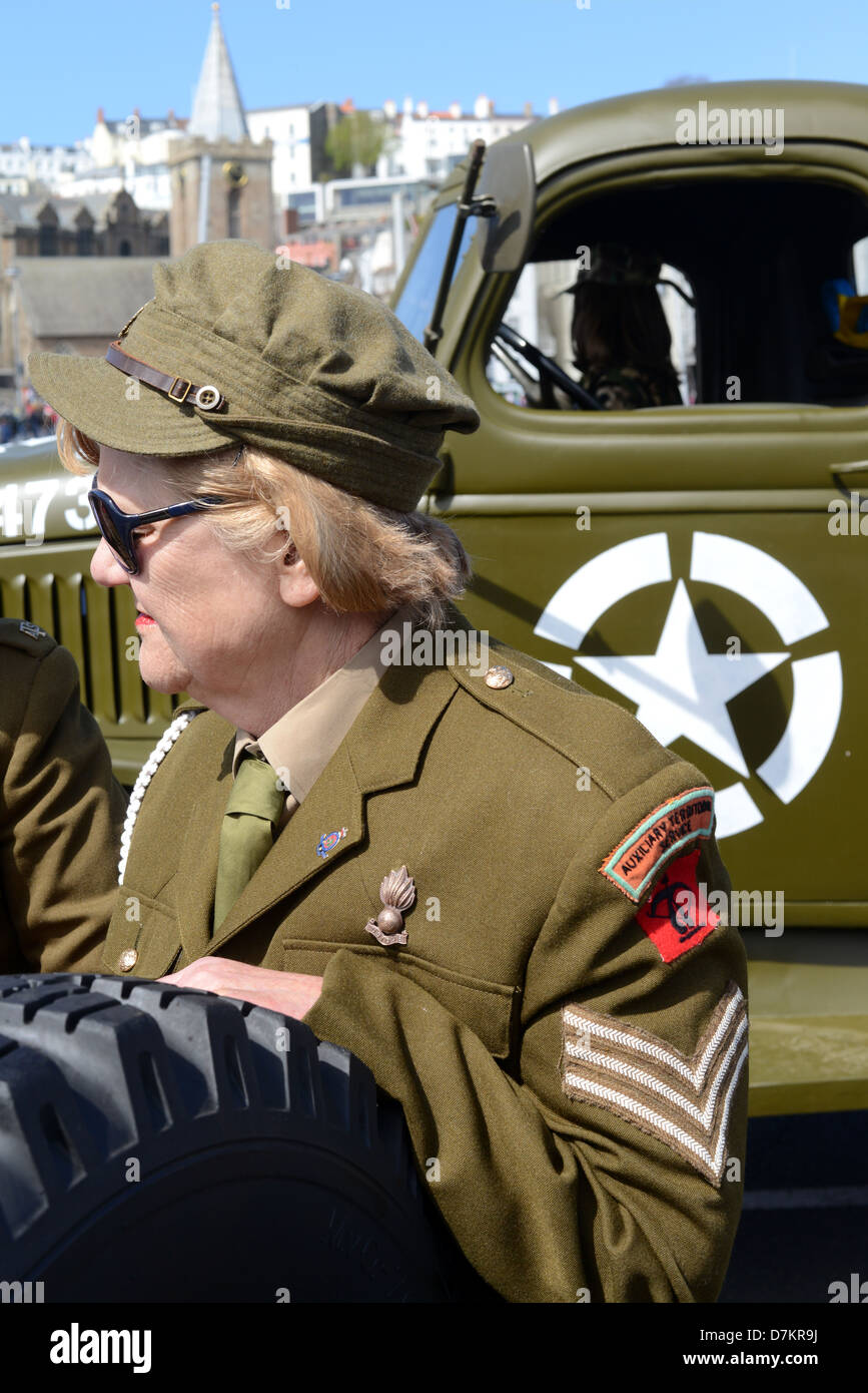 Woman dressed in WWII military uniform as part of Liberation Day celebrations in Guernsey Stock Photo