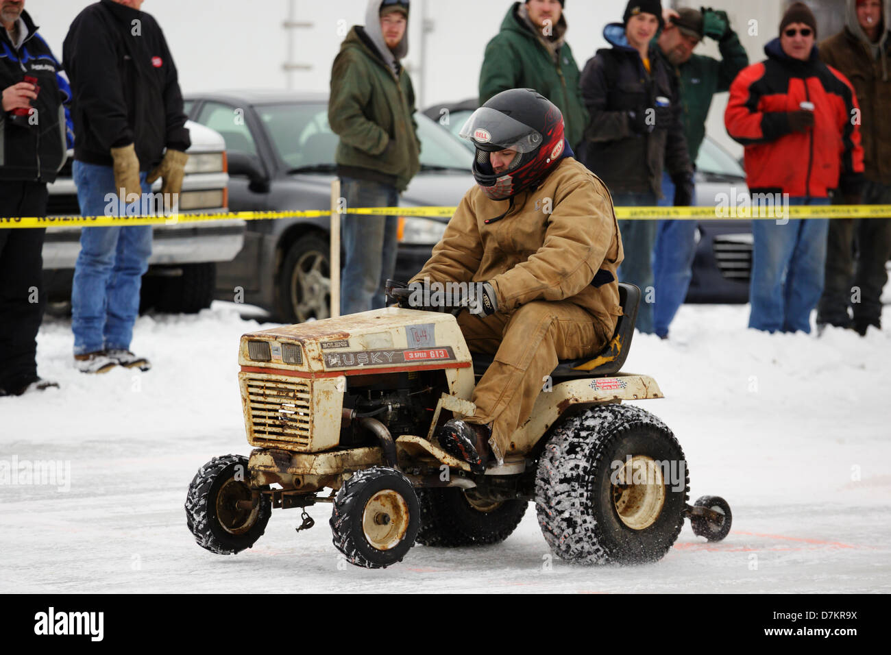 A man races a lawn mower during ice races on Knife Lake on February 9, 2013 in Mora, Minnesota. Stock Photo