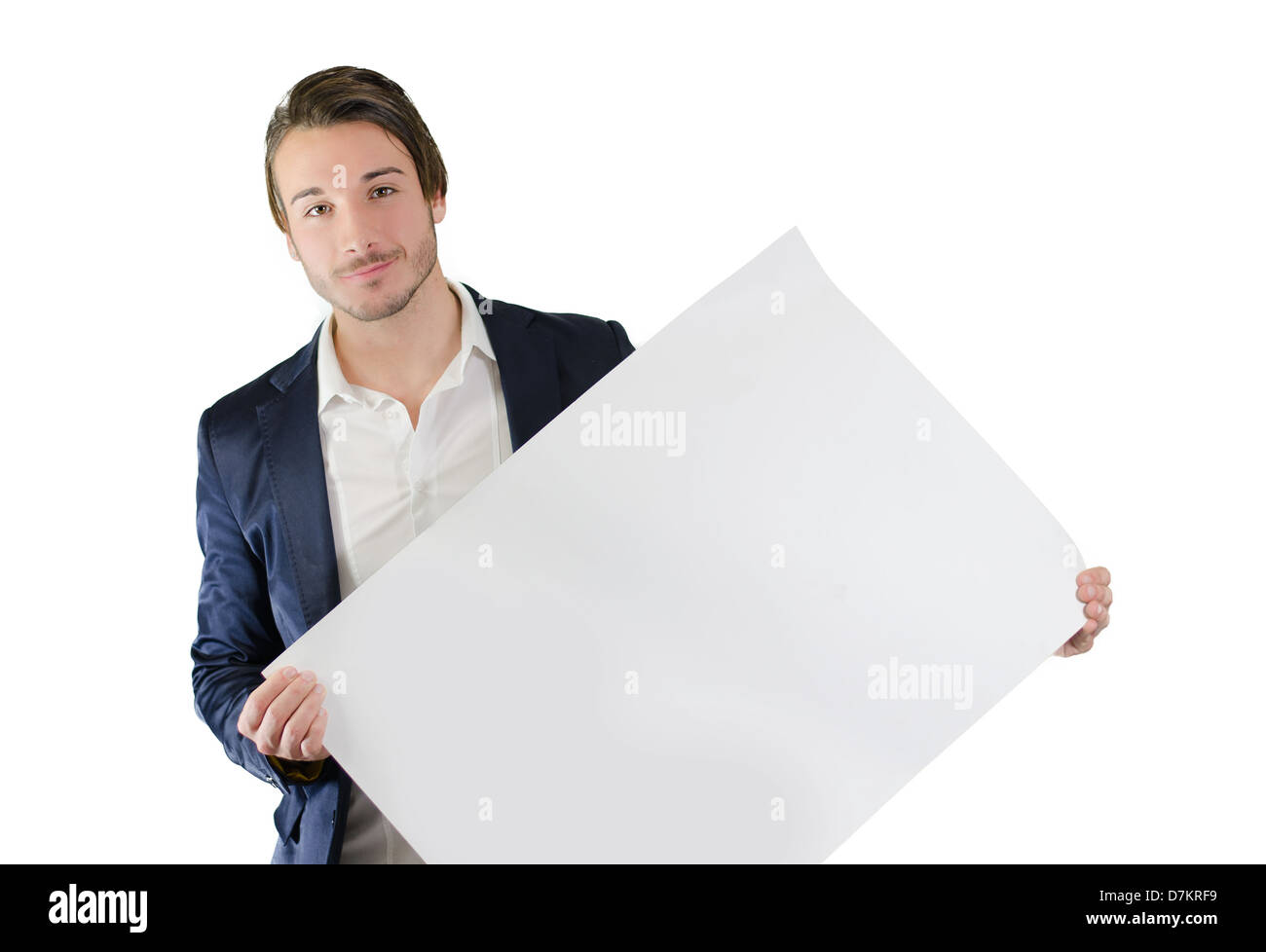Attractive young man holding and showing empty, blank white board, sign or paper sheet Stock Photo