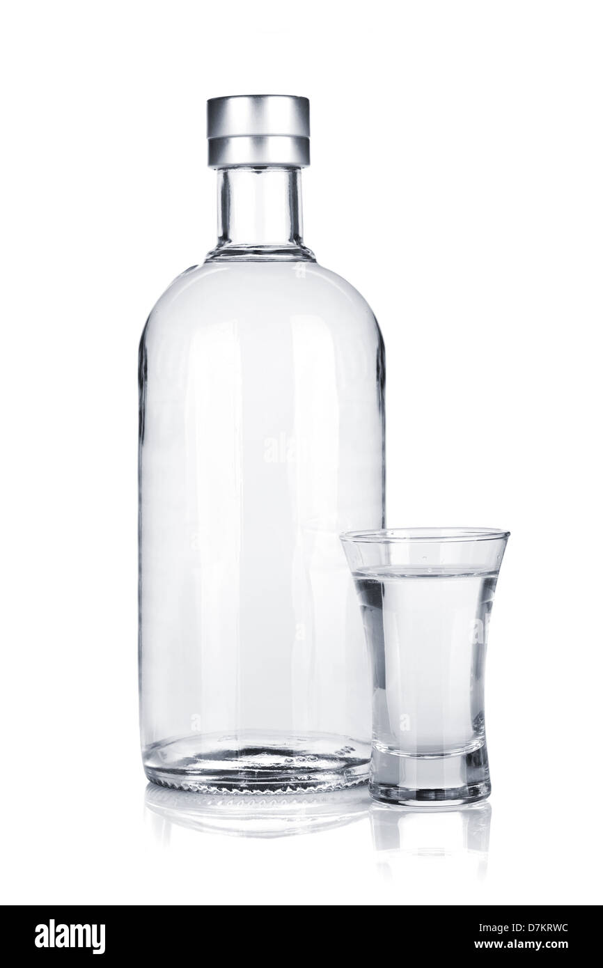 Bottle of vodka and shot glass. Isolated on white background Stock Photo