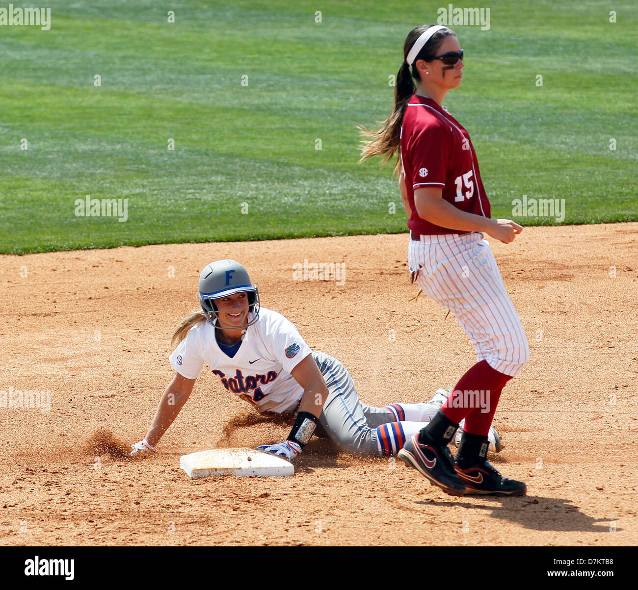 May 9, 2013 - Lexington, KY, USA - Florida's 24- Kirsti Merritt smiled after stealing second base in the bottom of the 3rd inning as Alabama's 15- Danae Hayes waited for the throw as The University of Florida played the University of Alabama in the SEC Softball tournament played at John Cropp Stadium on the UK campus in Lexington, Ky. Thursday May 9, 2013. Florida is the No. 1 seed and Alabama is No. 8 seed having advanced by defeating Texas A&M last last night.  Florida defeated Alabama 8-4. Photo by Charles Bertram | Staff  (Credit Image: © Lexington Herald-Leader/ZUMAPRESS.com) Stock Photo