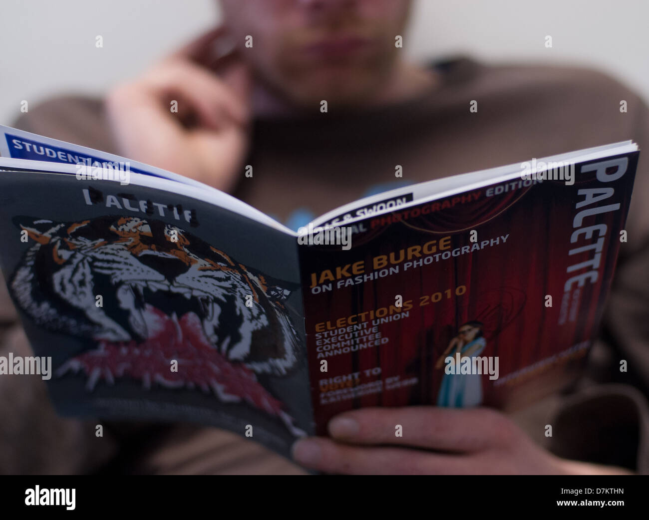 Image of a student reading Herefordshire Arts publication 'Palette', Hereford, England. Stock Photo