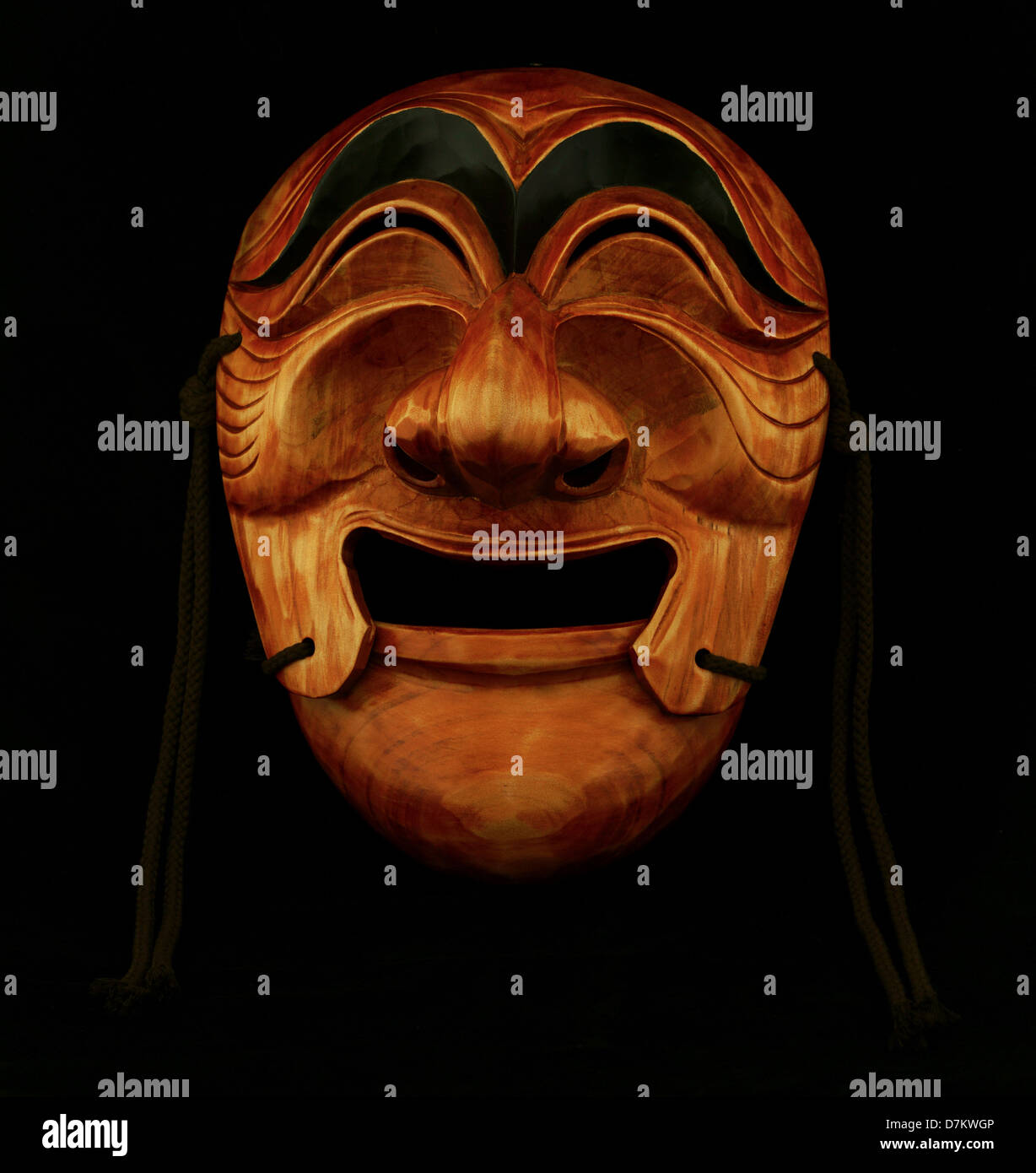 Korean traditional male wooden mask on a black background Stock Photo