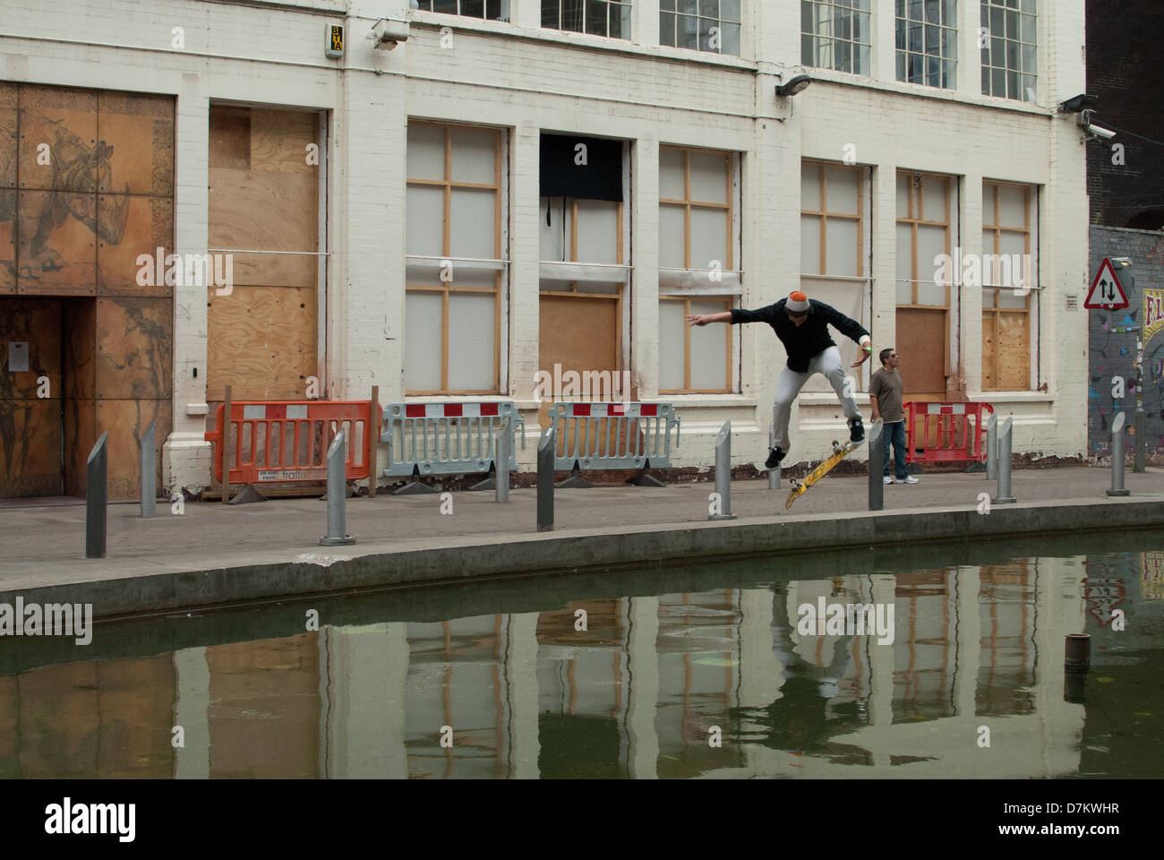 Skateboarder performing a trick in Custard Factory, Digbeth, Birmingham Stock Photo