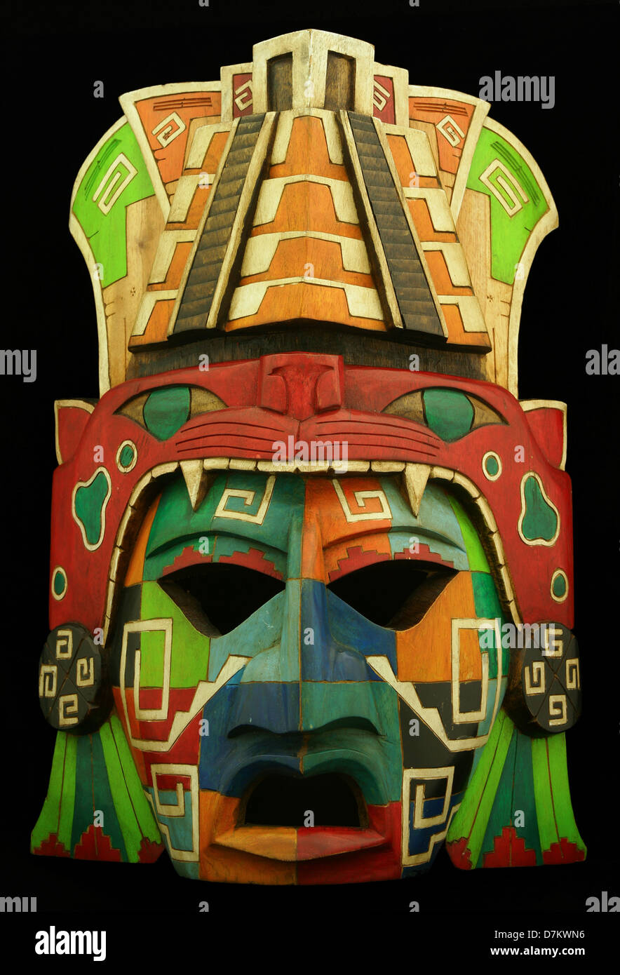 Wooden Mayan mask on a black background Stock Photo