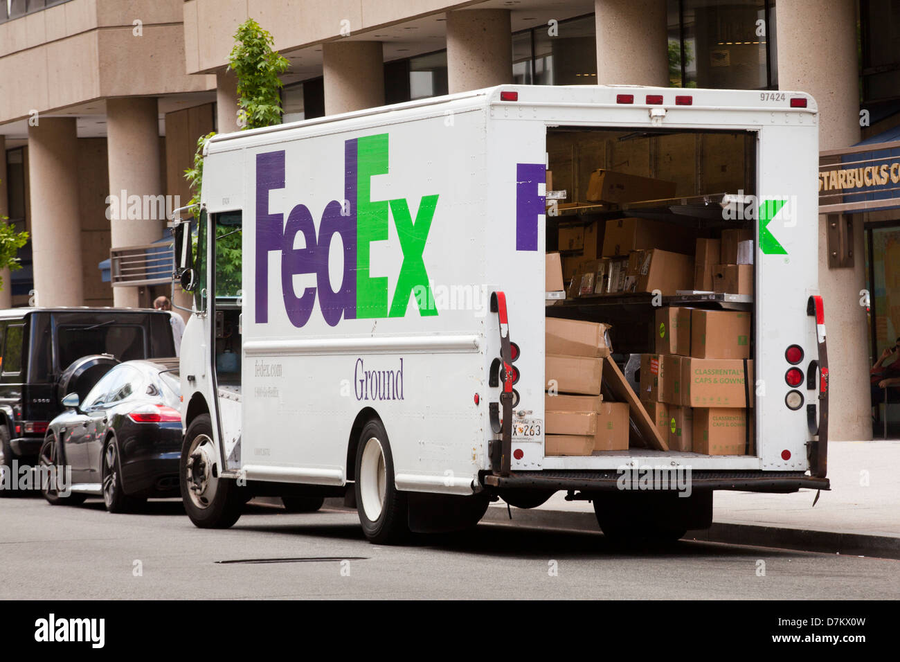 FedEx ground delivery truck with open door - USA Stock Photo
