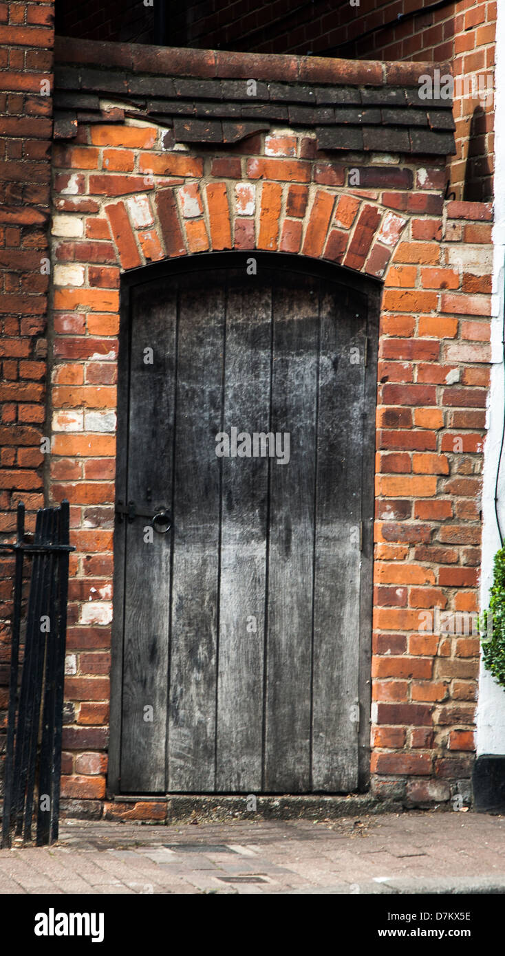 Old Wooden Gate in brick wall Stock Photo Alamy